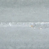 Detailbild von Kalkputz auf Beton