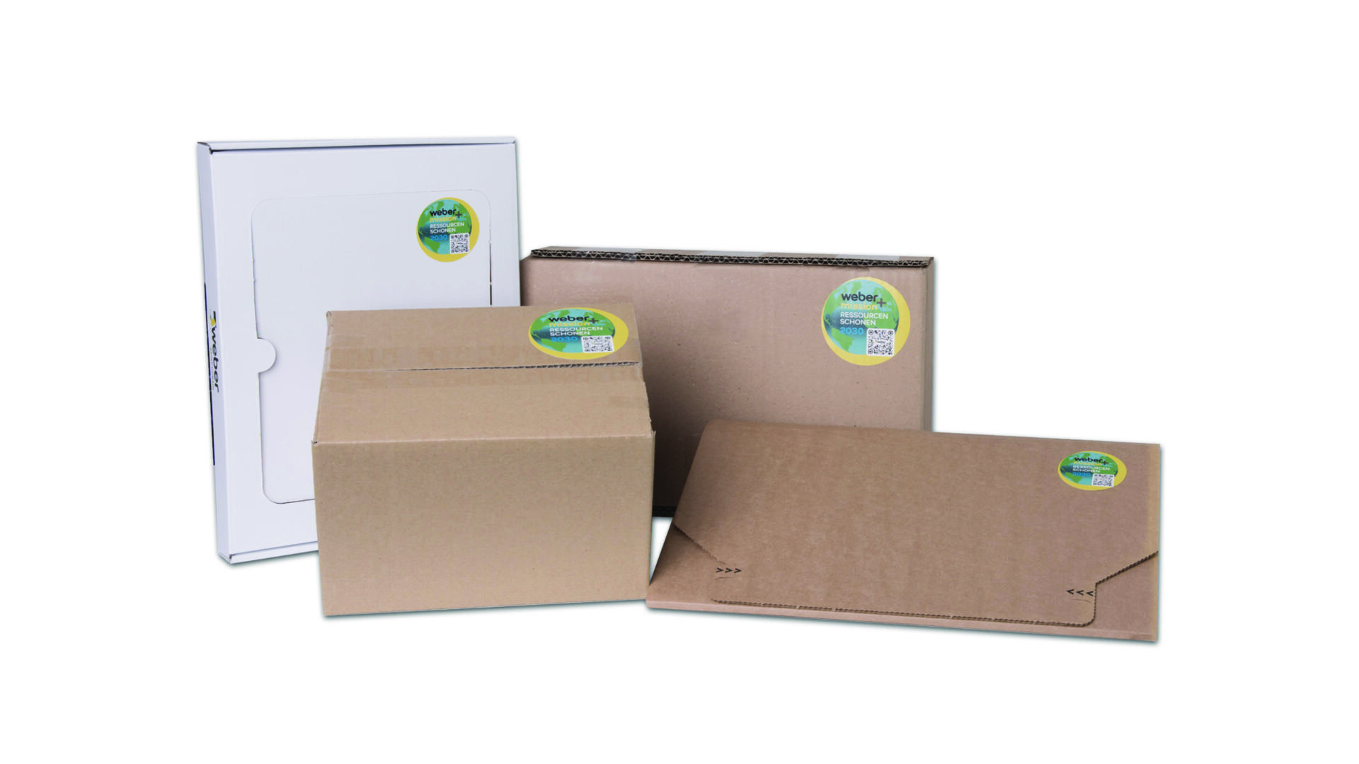 Nachhaltige Verpackungen Verschiedene Verpackungen aus brauner und weißer Pappe mit einem grünen Aufkleber