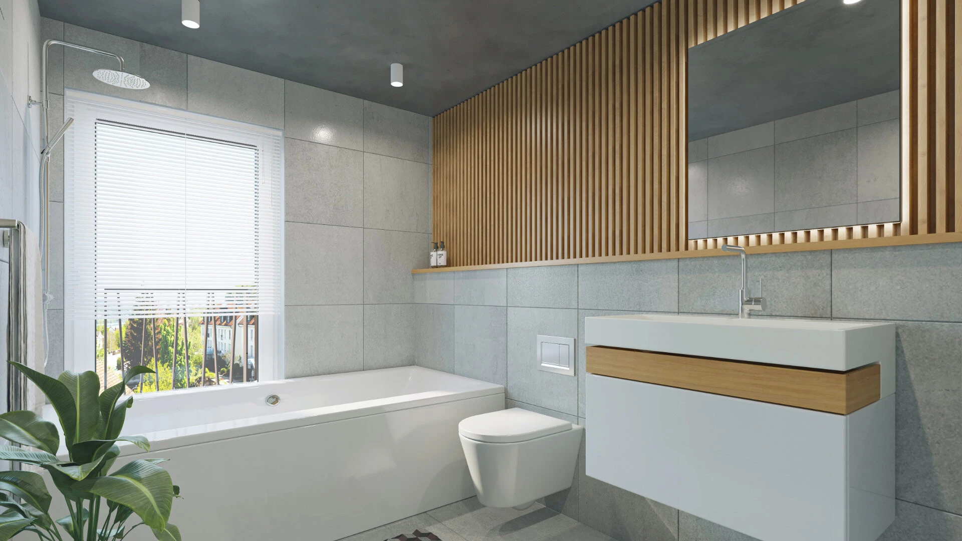 Modernes Badezimmer mit großen grauen Fliesen an Wand und Boden, einer weißen Badewanne, weißem Waschbecken, einem Spiegel in Holz eingelassen und einer Pflanze in der linken unteren Ecke. Foto ist von Backbone Visuals auf Unsplash